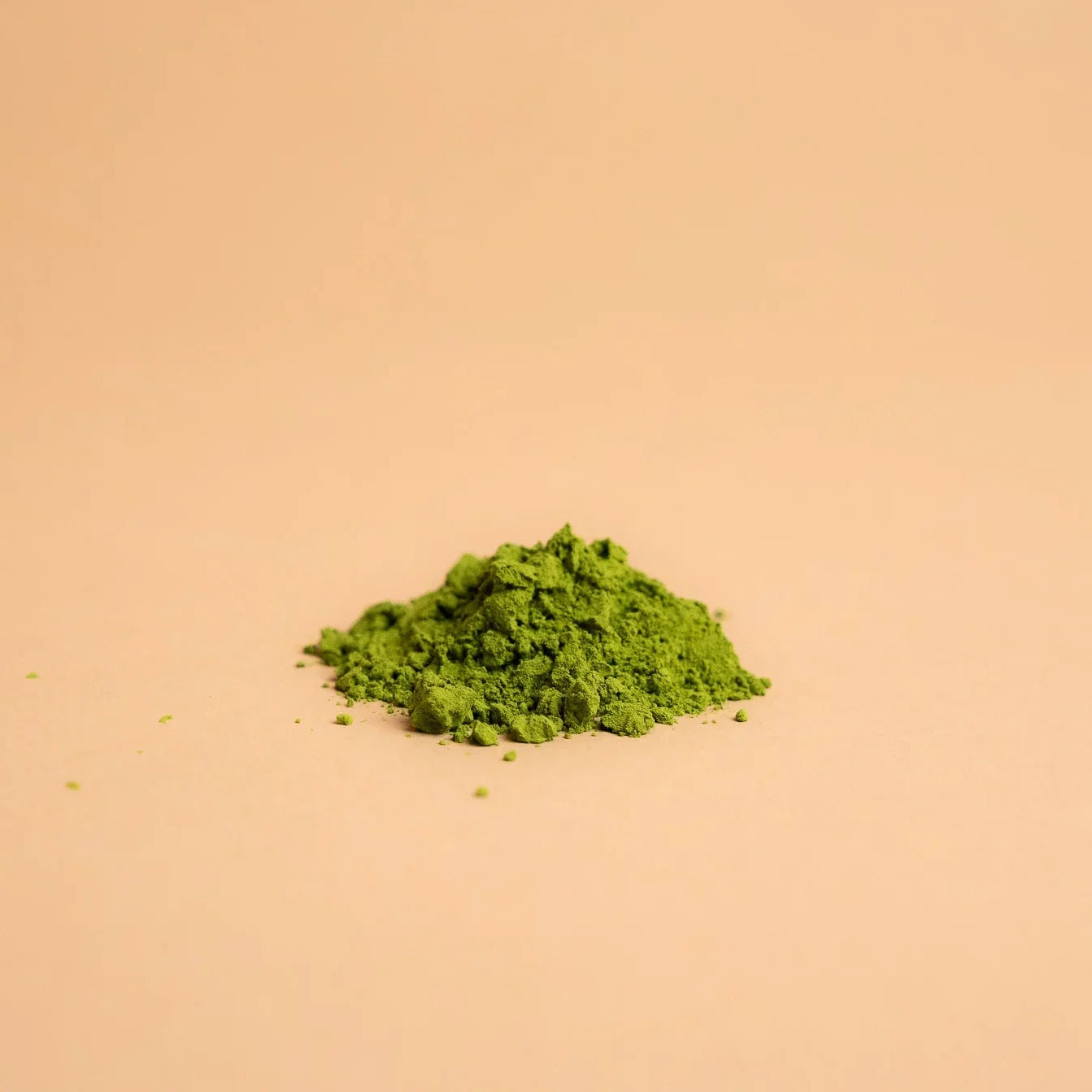 Ceremonial grade Japanese matcha green tea powder on a neutral background